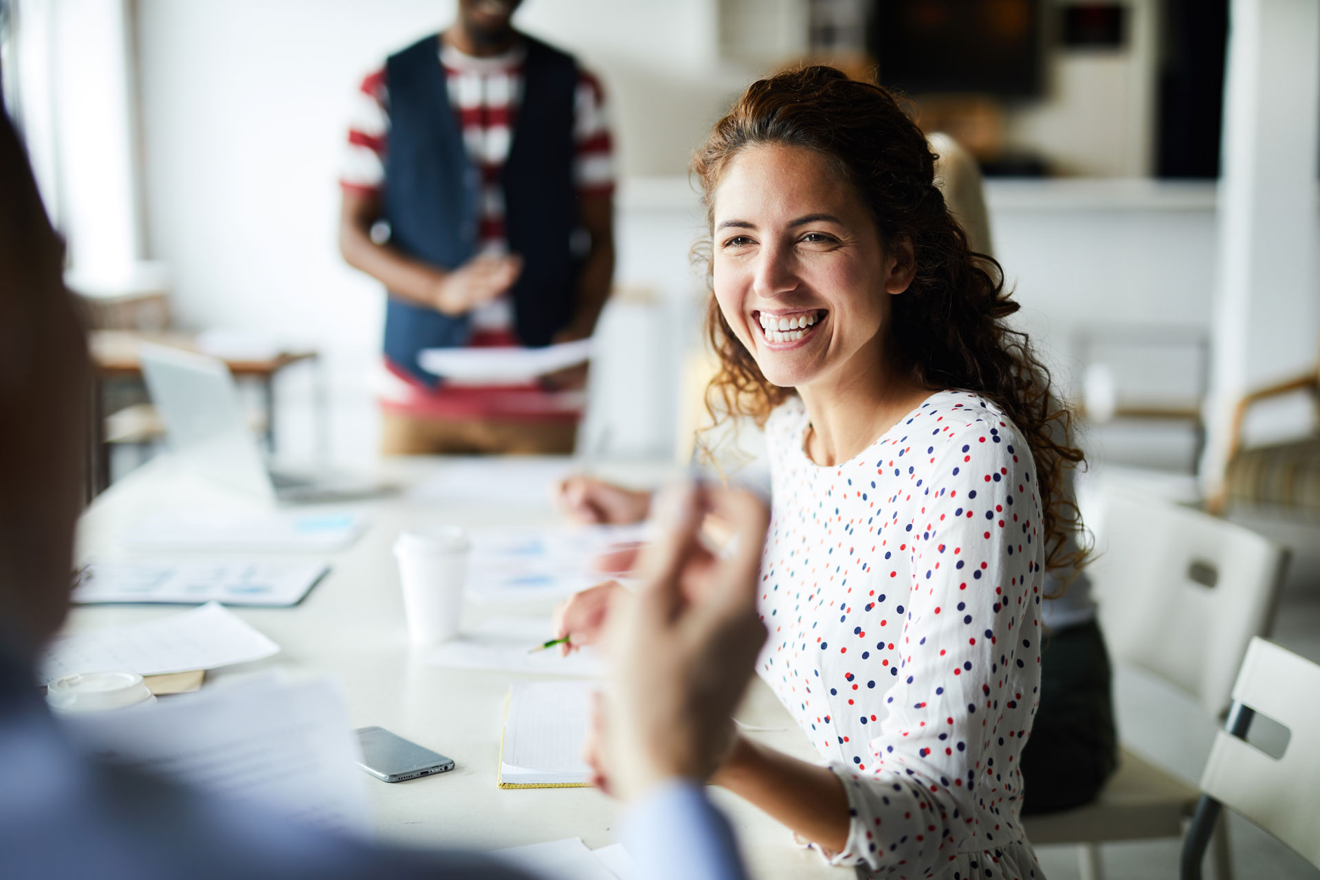 happy-businesswoman-at-meeting-YSNV8BJ.jpg